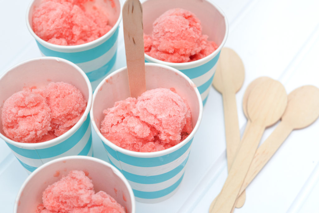 Homemade watermelon sorbet in blue paper cup