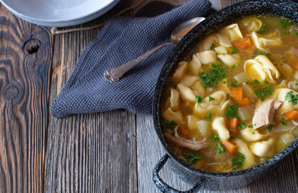 Pot with chicken noodle soup