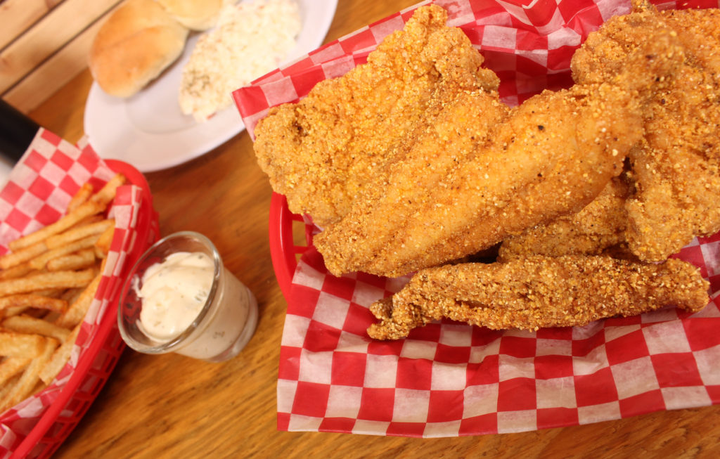 Fried Catfish With Coleslaw and French Fries in Rural Cafe